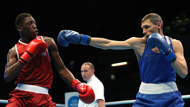 Spain's Youba Sissokho Ndiaye and Russia's Andrei Zamkovoi fight on day three of the Olympic qualifying event in London on March 16.