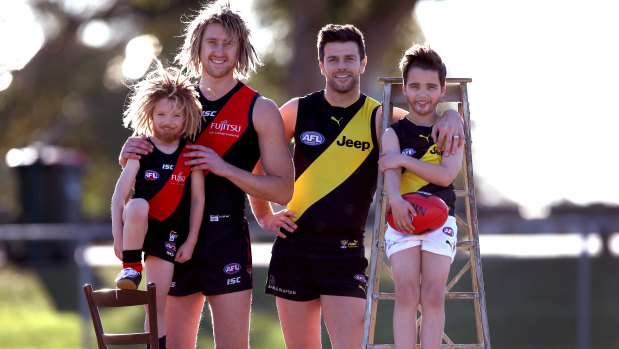 Dyson Heppell and Trent Cotchin with their respective NAB Mini Legends.
