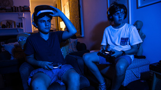 Billy Graham and Benjamin Baskin, both 13, play Fortnite at home in Stanmore.