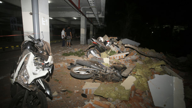 Debris fell on top of a motorcycles after the earthquake in Bali.