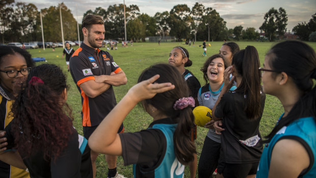 Star attraction: Stephen Coniglio captures the attention of the Fairfield Falcons under-13 girls.