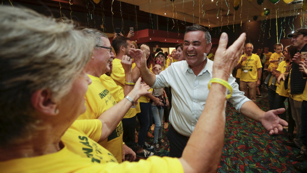 NSW Deputy Premier John Barilaro celebrates with supporters after claiming victory during his election night function at the Queanbeyan Kangaroo Leagues Club.