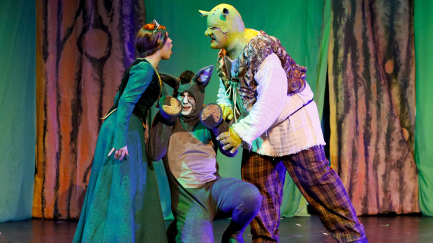 From left,  Laura Murphy as Princess Fiona, Joel Hutchings as Donkey and Max Gambale as Shrek in <i>Shrek the Musical</i>.