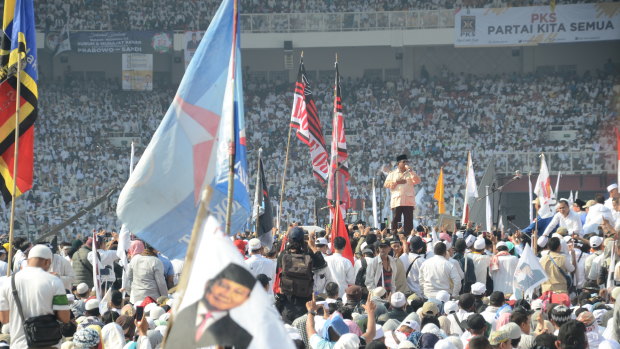 Indonesian presidential candidate Prabowo Subianto addresses more than a hundred thousand supporters at Gelora Bung Karno, Indonesia's national stadium on Sunday.