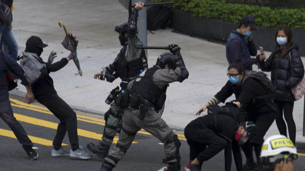 Riot police clash with protesters as the pro-democracy protests continue in Hong Kong.