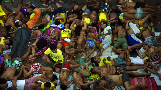 Some of the 3562 inmates, incarcerated as part of the Philippines drug war, sleep in Quezon City Jail, Manila, in 2016.