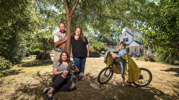Out of the ashes: Black Saturday survivor Melanie Harris-Brady in front of the new house on her  Kinglake block, with husband Anthony, daughter Keeley, son Oscar and dog Toby.