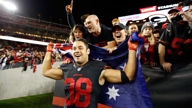 Hayne poses with fans after helping the San Francisco 49ers to victory over Minnesota in the NFL.