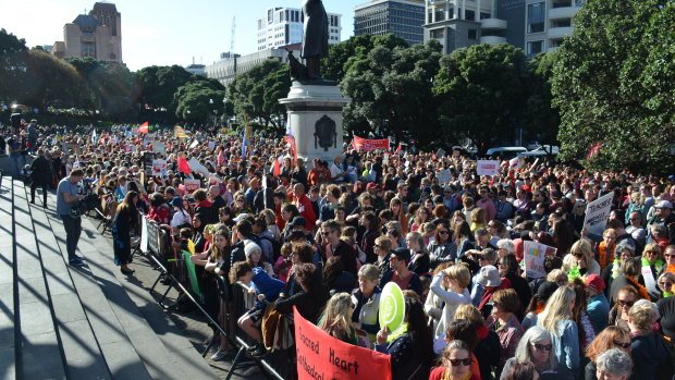 Some 50,000 teachers walked off the job over a pay dispute ahead of the government's annual budget. Here they gather outside Parliament in Wellington.