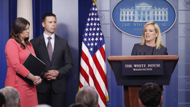 Homeland Security Secretary Kirstjen Nielsen, right, speaks while White House press secretary Sarah Huckabee Sanders, left, and Commissioner of U.S. Customs and Border Protection Kevin McAleenan, look on.