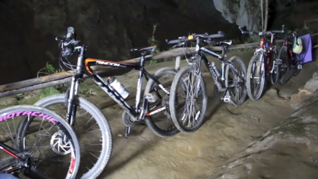 Bicycles left by a group of boys who went missing parked outside a deep cave in Chang Rai, northern Thailand. 