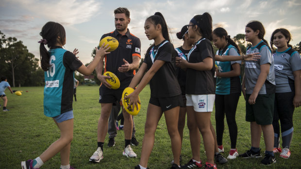 Most of the girls are playing Australian rules for the first time. 