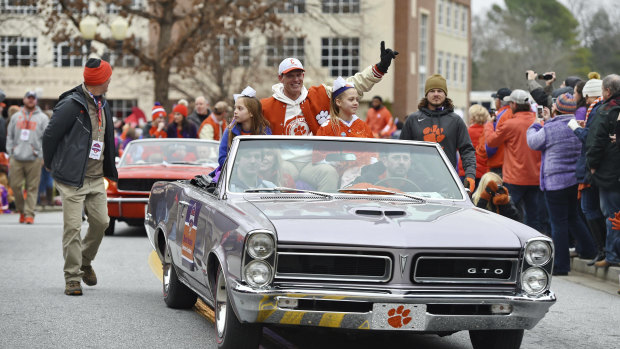 Defensive head coach Brent Venables rides in the parade honouring Clemson University's football team on Saturday.