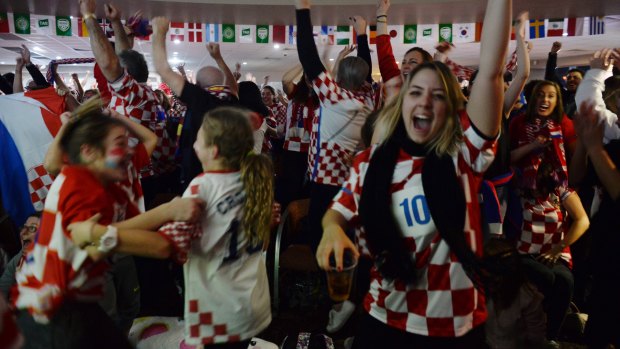 Croatian fans at the King Toms Club in Edensor Park celebrate Croatia's equaliser.