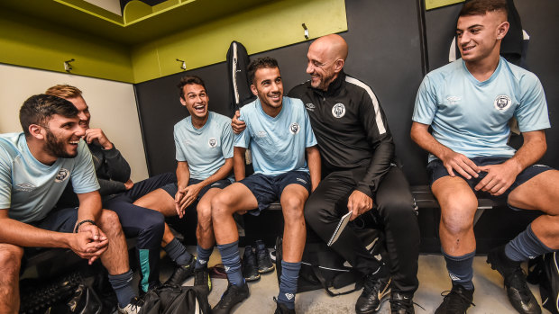 Hakeem Al-Araibi. pictured here with his teammates and coach Vitale Ferrante, is back at training with his Pascoe Vale club.