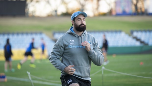 New surroundings: Aaron Woods trains with Cronulla for the first time on Tuesday.