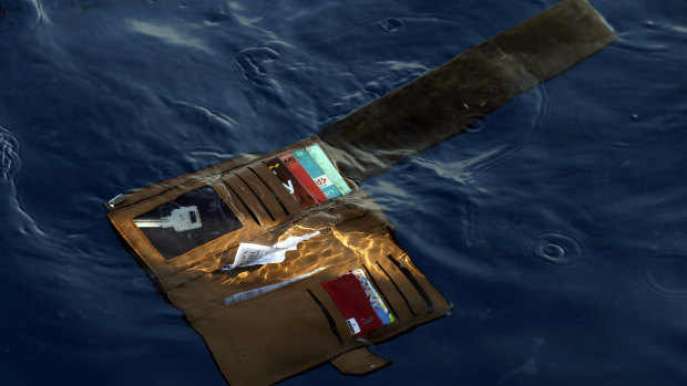A wallet belonging to a victim of the Lion Air crash floats in the waters of Ujung Karawang, West Java.