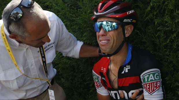 Devastated: Australia's Richie Porte receives medical assistance following a crash during the ninth stage of the Tour de France.