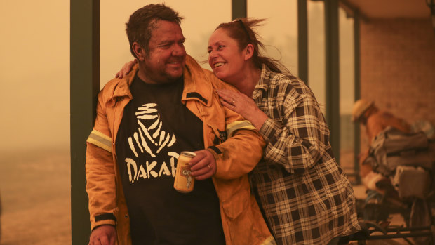 Bumbalong residents Laurence and Claire Cowie were happy they were able to save their home.