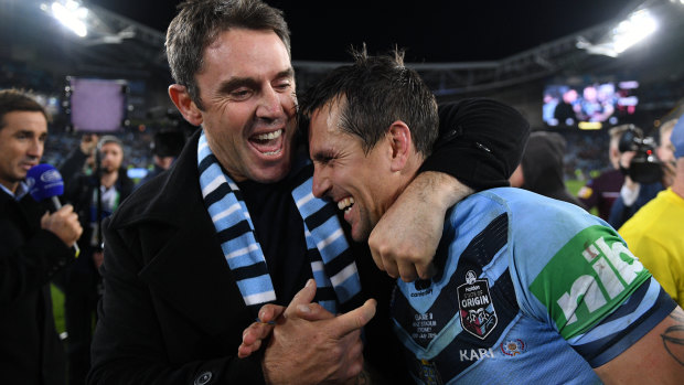 NSW coach Brad Fittler congratulates his halfback Mitchell Pearce after the Blues' series win last year.