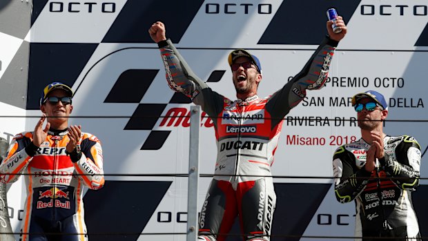 Dominant: Andrea Dovizioso is flanked by runner-up Marc Marquez (left) and third-placed Cal Crutchlow.