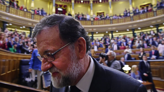Spain's Prime Minister Mariano Rajoy leaves the Spanish parliament after a motion of no confidence vote in Madrid on Friday