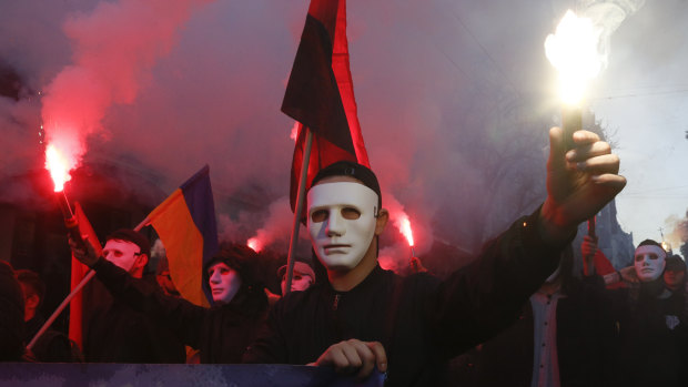 Ukrainian nationalists light flares during a rally marking Defence of the Homeland Day in Kiev. 