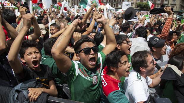 Fans celebrate as Mexico go on to win against reigning world champions Germany.