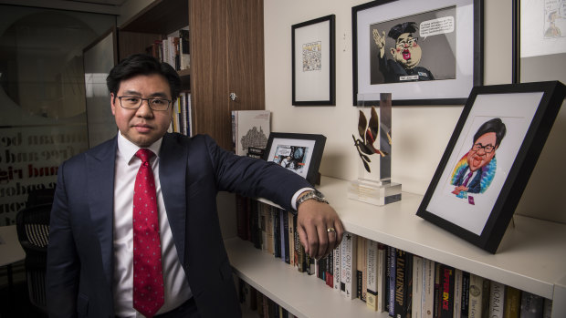 Tim Soutphommasane in his office with some of his Bill Leak cartoons.
