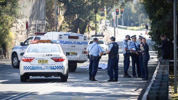 Police on the street in Forest Lodge where Mr McKee died.