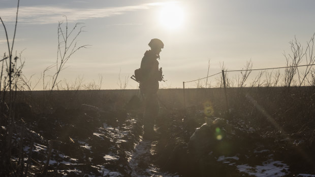 A Ukrainian soldier walks on the line of separation from pro-Russian rebels, in Mariupol, Donetsk region, Ukraine.