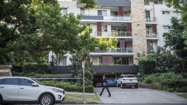 Police establish a crime scene at a unit block at Pymble after a woman's body was found in a freezer.