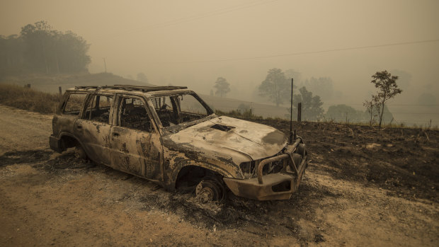 A burnt out vehicle on the fireground in Taylors Arm near Macksville in northern NSW.