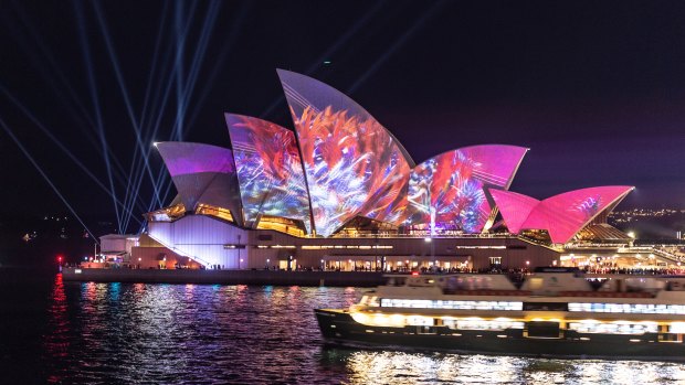 The sails of the Opera House are lit up with an animated Austral Flora Ballet by Andrew Thomas Huang.