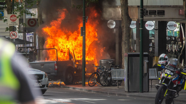 The moment the car burst into flames on Bourke Street.