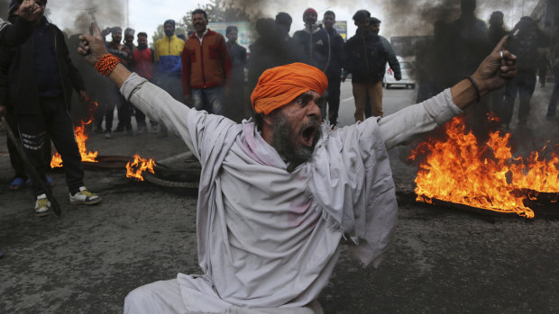 A protestor shouts slogans against the  attack on a paramilitary convoy in which 40 soldiers died in Jammu, India, last week.