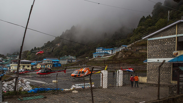 A rescue helicopter lands at an airport in Lukla, Nepal, near Mount Everest.