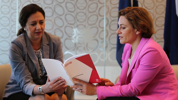 Premier Annastacia Palaszczuk looks over the 2018-19 budget with Treasurer Jackie Trad.