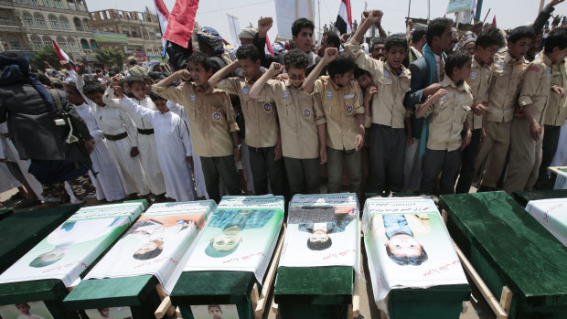 Yemeni people attending the funeral of victims of a Saudi-led airstrike in August.
