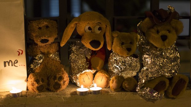 Stuffed toys wrapped in aluminium foil outside the US embassy in Guatemala City represent migrant children separated from their families.