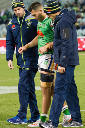 Feeling blue: Nick Cotric limps off.
