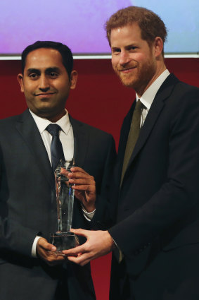 Usman Iftikhar posing with Prince Harry after winning the Commonwealth Youth Award for 2018 in London.