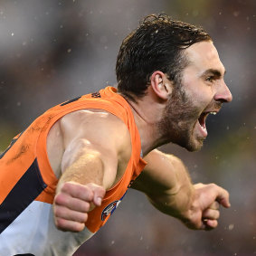 Flying: Jeremy Finlayson of the Giants celebrates kicking a crucial goal at the MCG.