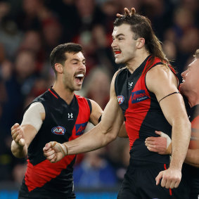 Essendon cult figure Sam Draper celebrates a goal.