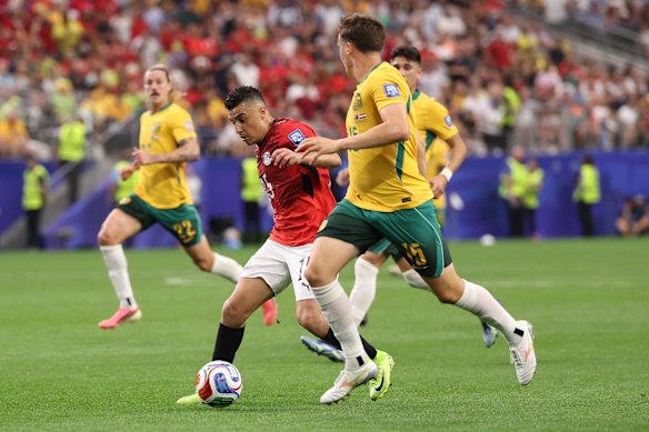 Karim Hafez challenges for the ball with Kai Trewin.