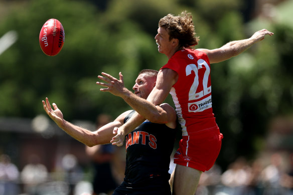 Giants forward Jesse Hogan deals with an aerial challenge from Nick Blakey.