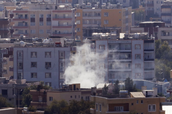 Smoke billows from targets in Ras al-Ayn in Syria on Friday.