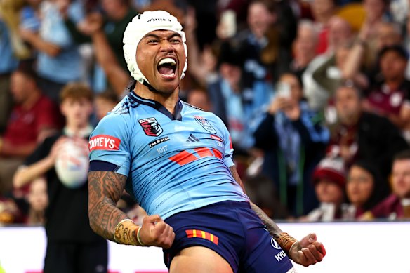 Brian To’s celebrates his first-half try.