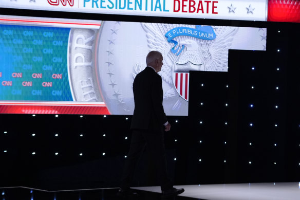 Joe Biden walks from the stage during a break in a presidential debate with Donald Trump.