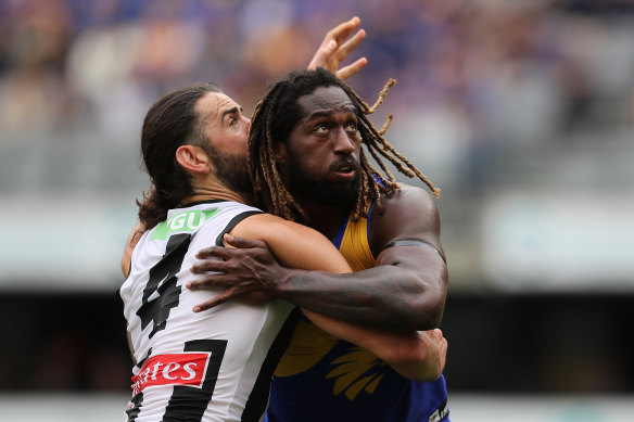 Compare the pair: Brodie Grundy, left, and Nic Naitanui, right, during round eight. 